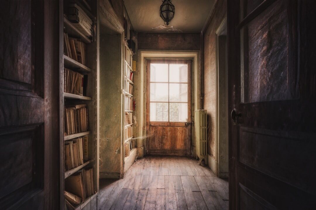 Interior of an old wood-panelled library with warm reading light